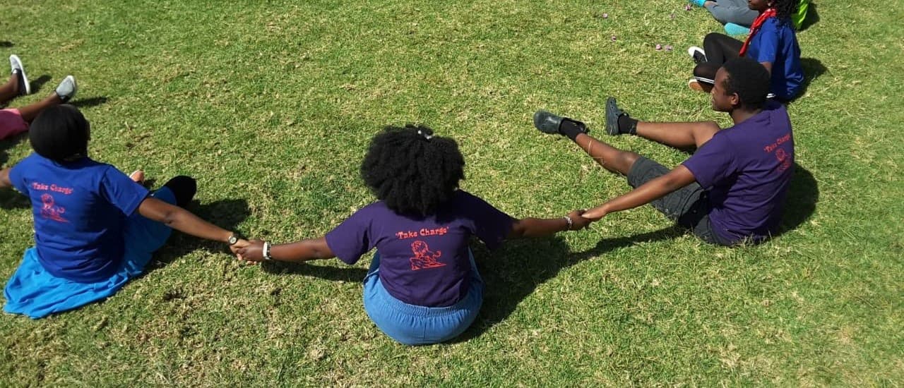 TYC youth holding hands